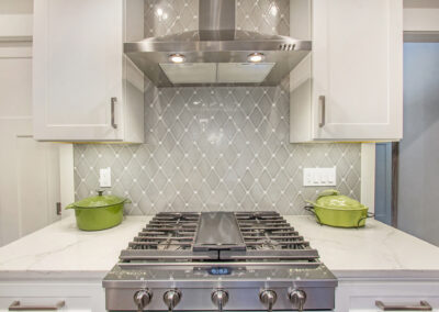Custom Home Chef's Range with Hood Vent and Custom Tile Wall