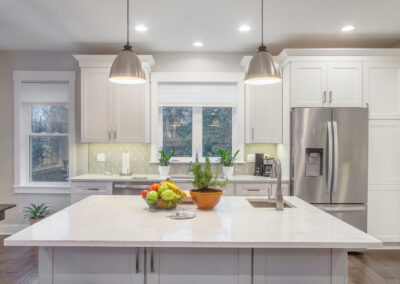 Custom Home Marble Kitchen Island and White Cabinets