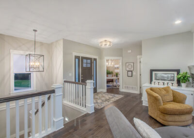Custom Home Front Door Entryway into Living Area and Stairs to Lower Level